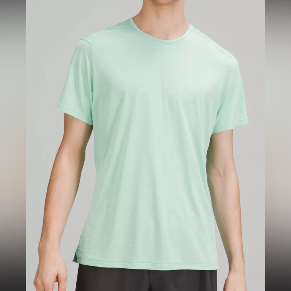 Lululemon mint colored tee shirt with stripes and signature silver logo‎